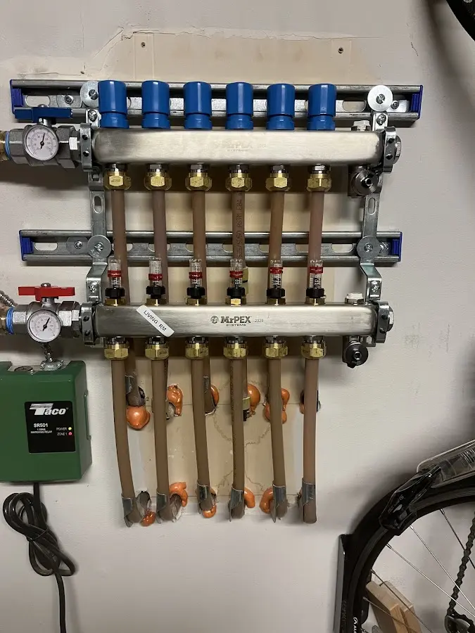 Plumber performing Water Heater Repair at a residential property in Rossville